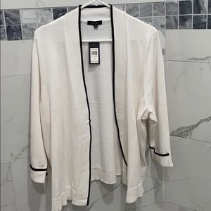 White and black cardigan.